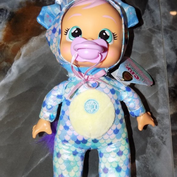 NWT Cry Babies Tiny Cuddles 9" Baby Doll Blue Tina the Triceratops Dinosaur - Picture 1 of 3